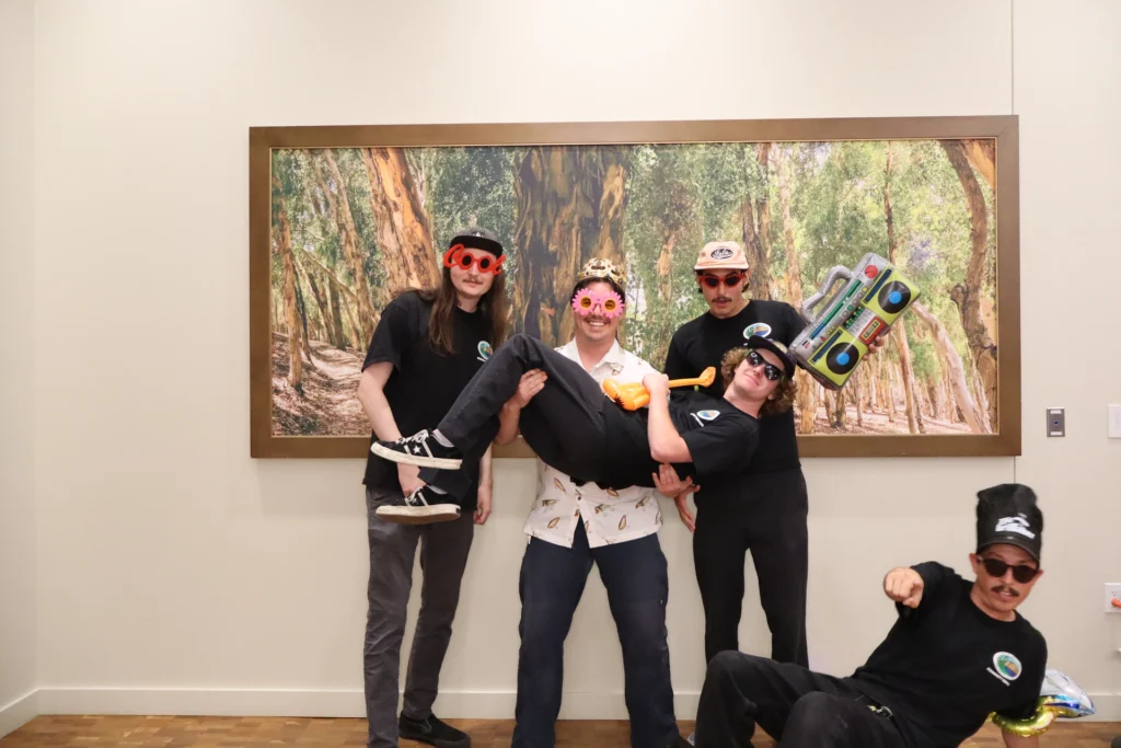 Group of guests showing playful personality at a beÜtiful Pixels photo booth experience
