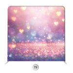 Pink, purple, and blue photo booth backdrop with glowing heart bokeh and sparkling dreamy light effects.